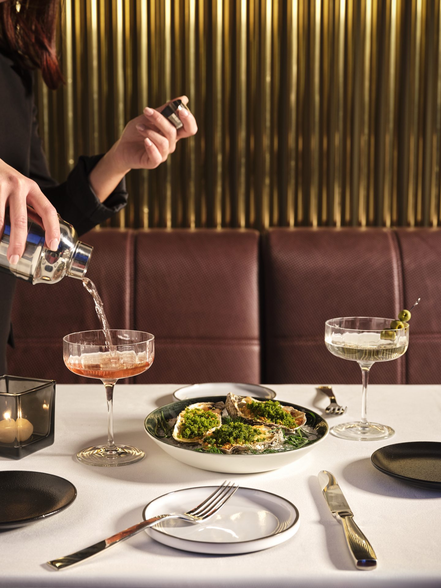 Waitress pouring cocktail at Rivington Cucina New York in Milan